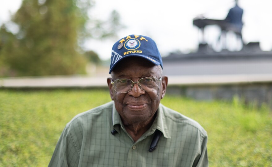Johnnie Armstrong, sitting in front of the Ray Charles Memorial on Aug. 29, 2022, says he has voted in Albany, Ga., since 1955.