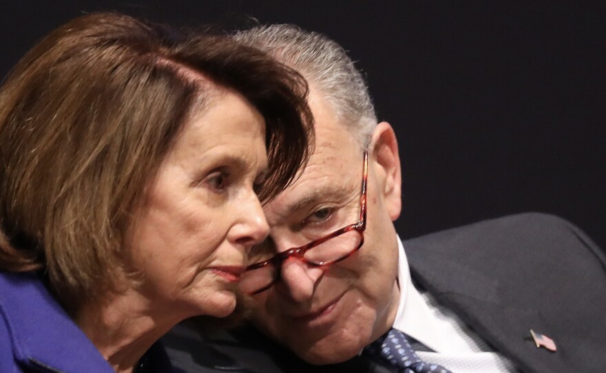 Senate Minority Leader Chuck Schumer, D-N.Y.,speaks with House Minority Leader Nancy Pelosi, D-Calif., during a ceremony at the U.S. Capitol in November 2017.