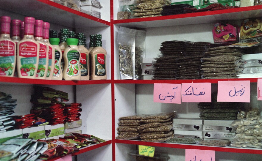 Spices, candies and other goods familiar to Afghans line the shelves of a store in Trabzon owned by Ahmad Javaheri, who is from the western Afghan city of Herat.