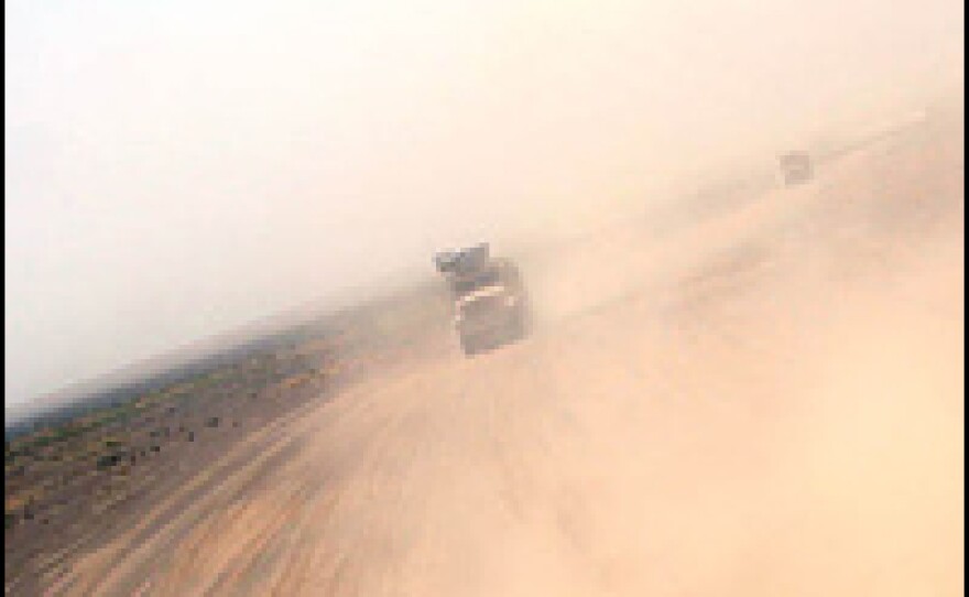 A huge U.S. military convoy makes its way across the desert in southern Afghanistan.