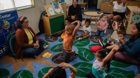 Students gather to read a book during class at Mi Escuelita in San Diego on April 29, 2025. Mi Escuelita is a therapeutic preschool for children affected by domestic violence or other family-related trauma. Students receive on-site therapy and social-emotional learning skills to help them heal.