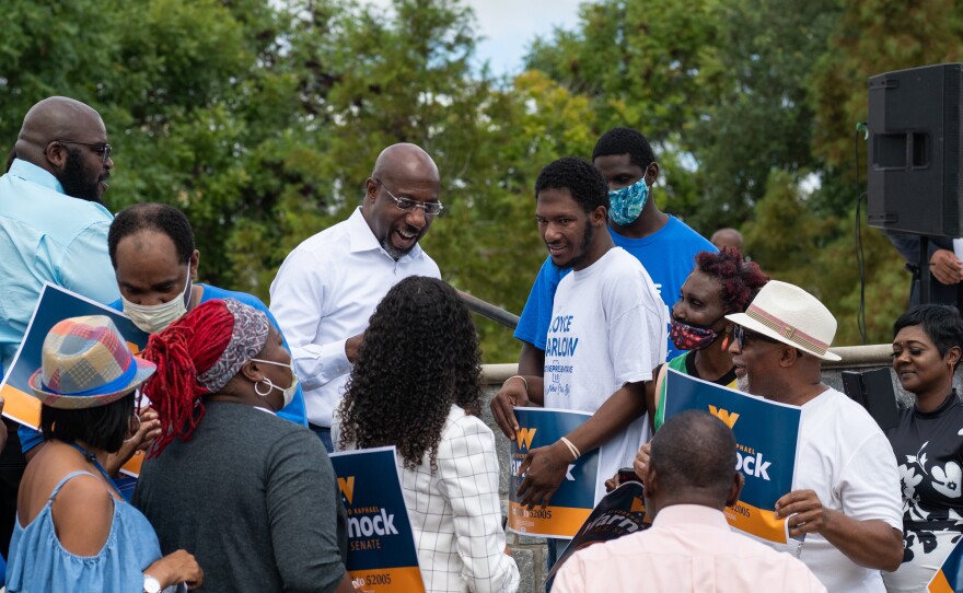 U.S. Sen. Raphael Warnock's campaign bus tour in Albany, Ga., on Aug. 29, 2022.