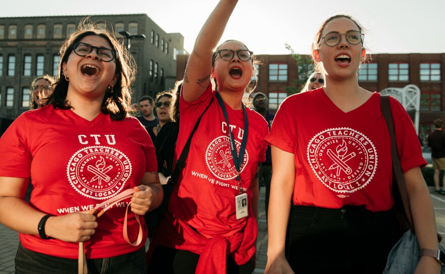 Chicago Teachers Union members cheer at a rally ahead of a potential strike.