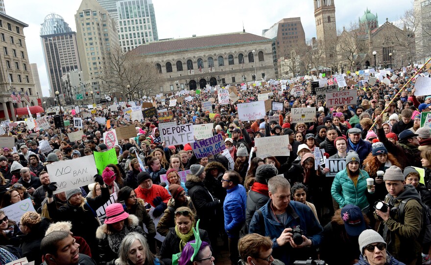 People gather in Boston's Copley Square to protest the immigration ban enacted by President Trump.