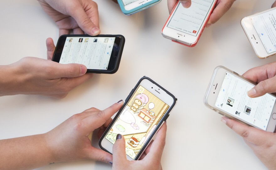 Tough thumbs but weak hands? Millennials use technology in their workplaces more than their counterparts in 1985.