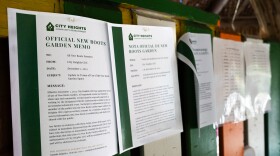 Signs with City Heights Community Development Corp. insignia hang at New Roots Community Farm announcing a change in rules regarding public entry on Dec. 3, 2024.