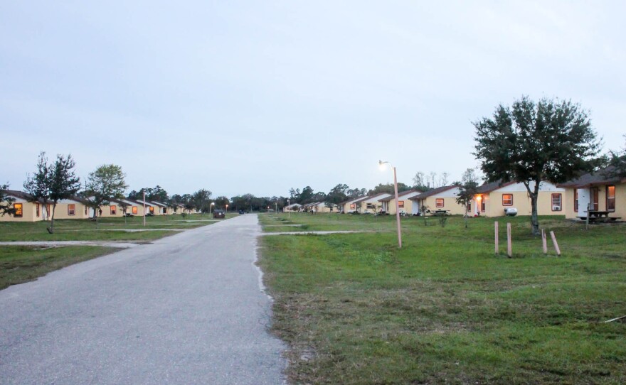 Some employers build special housing compounds just for their H-2A workers. About 300 workers live in this fenced compound.
