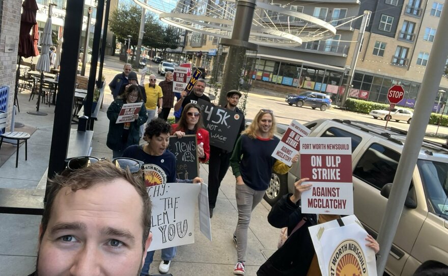 NewsGuild President Jon Schleuss (foreground) marches with journalists at the <em>Fort Worth Star-Telegram </em>during a strike in November 2022.