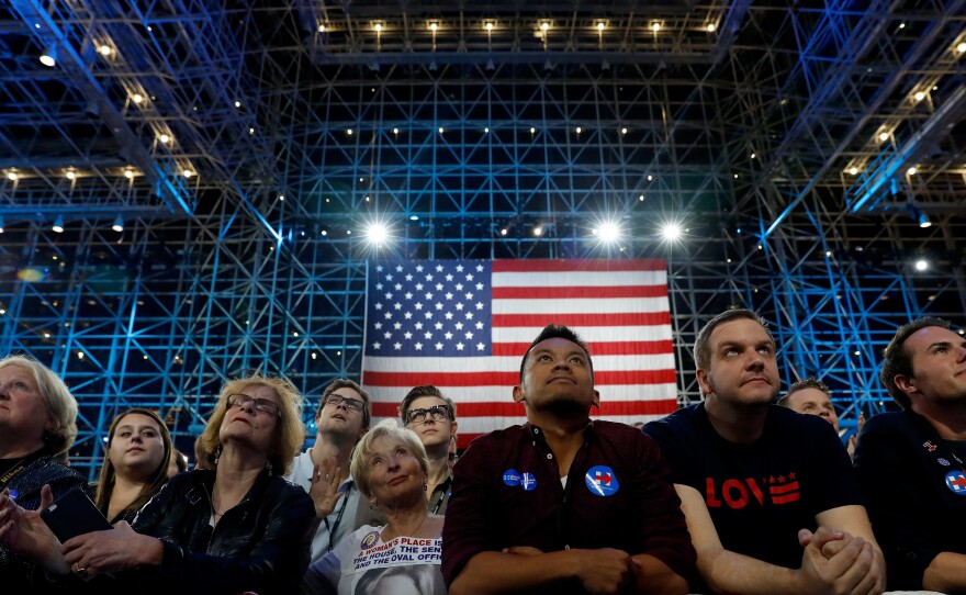Supporters watch voting results at Clinton's election night event at the Jacob K. Javits Convention Center, which features a huge glass ceiling, on Nov. 8 in New York City.