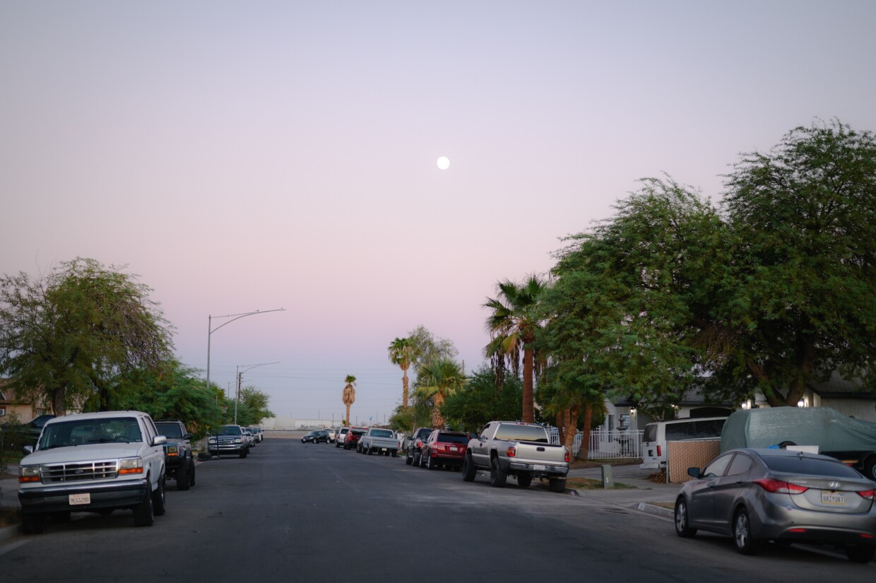 The moon rises above a neighborhood in El Centro, California in Imperial County on October 15, 2024.