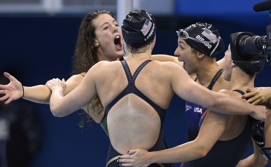 Allison Schmitt, Katie Ledecky, Madeline "Maya" Dirado and Leah Smith celebrate after they won the Women's 4x200m Freestyle Relay final for the U.S. Wednesday night at the Rio 2016 Olympic Games.