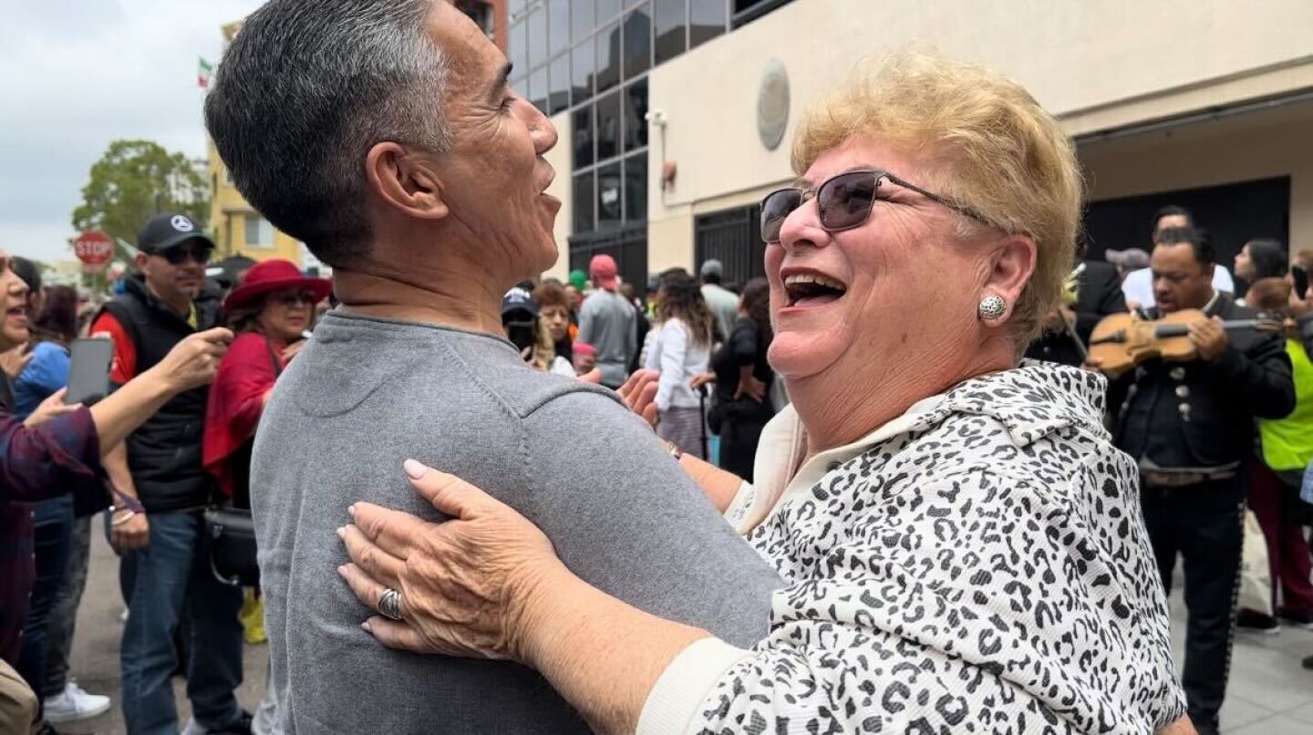People dance along to live mariachi music on June 2, 2024, outside the Consulate General of Mexico in Little Italy, San Diego.