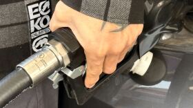 Man pumps gas at a Chula Vista Chevron station as gas prices rise on March 5, 2026.