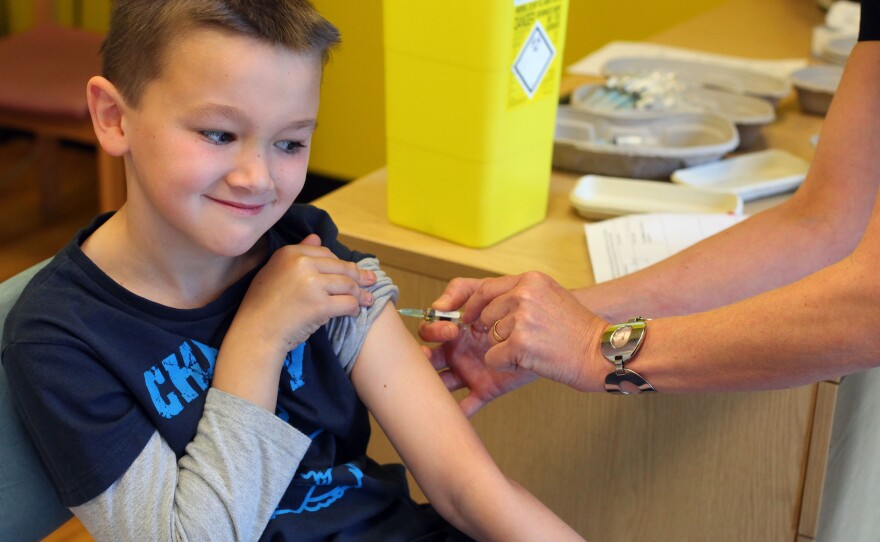 Luke Tanner, 7, gets vaccinated for measles at a clinic near Swansea, Wales, in April. Wales is at the center of a measles outbreak that has been linked to one death.