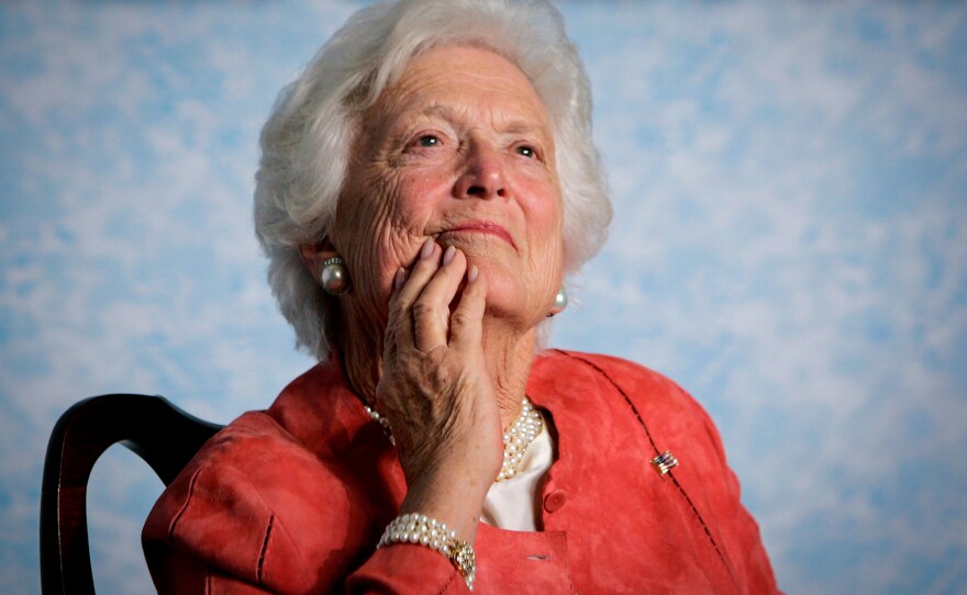 In this file photo from Friday, March 18, 2005, former first lady Barbara Bush listens to her son, President George W. Bush, as he speaks on Social Security reform in Orlando, Fla.