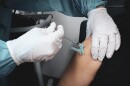 An employee of the Imperial County Public Health Department receives her first dose of the COVID-19 vaccine on Dec. 18, 2020.