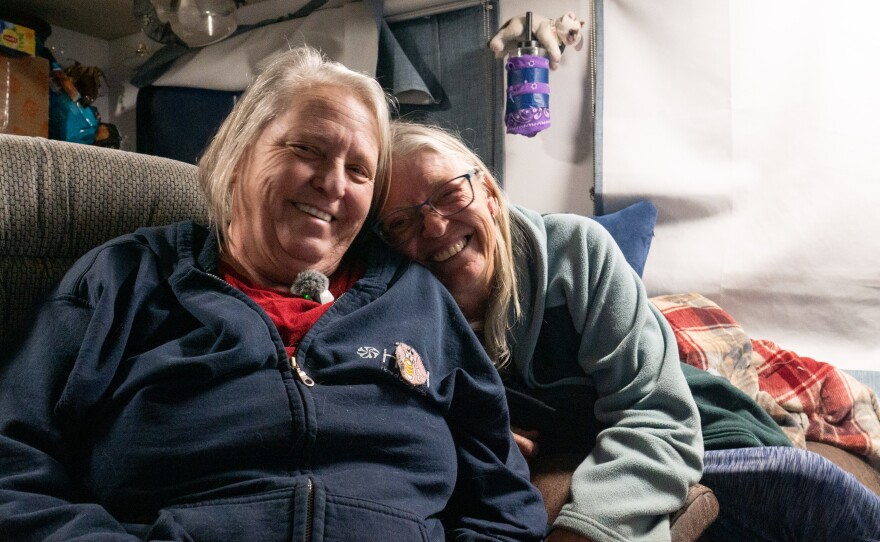 Steph Tonkin (left) and Lisa Hilyer smile for a photo in Tonkin's home on Jan. 21, 2026.