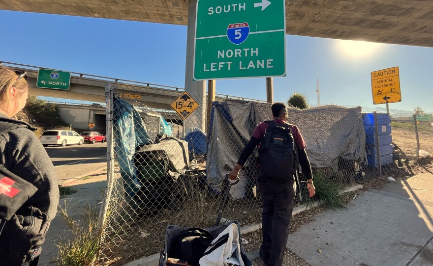 The Father Joe's Villages street health team visits an encampment near an I-5 onramp on Tuesday, Jan. 21, 2025.