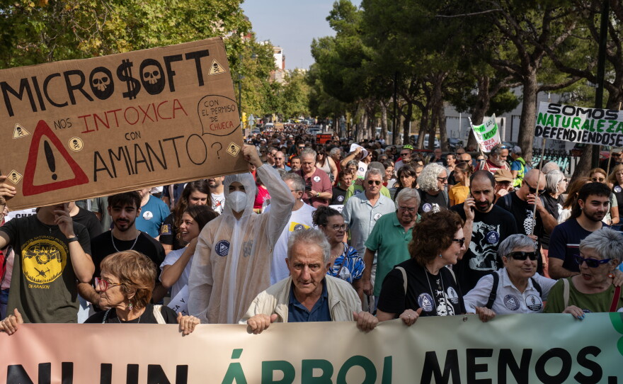 Hundreds of protesters walk through the streets of Zaragoza, Spain, on Sept. 27. The Spanish region of Aragon is seeing a huge surge in data center construction, which has alarmed many local residents due to their high energy use, noise pollution and heat generation. Microsoft and Amazon are among those building in the region.