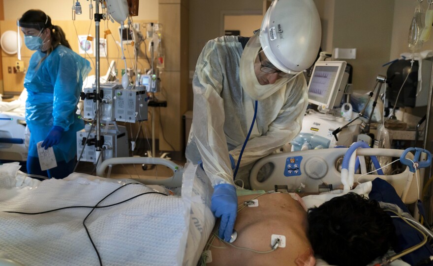A patient is treated for COVID-19 at Providence Holy Cross Medical Center in Los Angeles. Hospitalizations because of the coronavirus are surging in California.