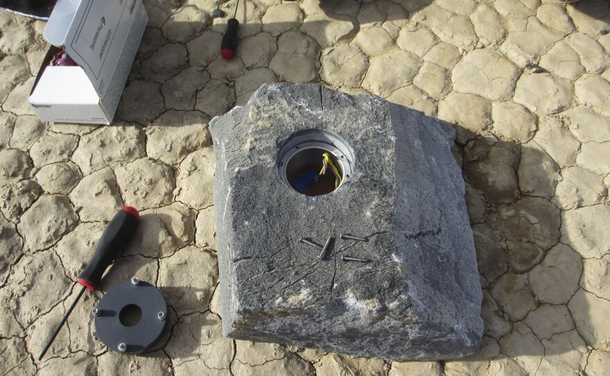 The cavity in this rock will carry the GPS instrument package and its battery pack across the desert.