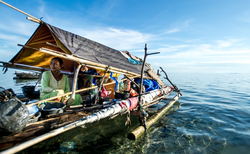 Ibu Diana Botutihe has lived her entire life at sea, visiting land only intermittently to trade fish for rice, water and other staples. Here she is pictured on her boat in Sulawesi, Indonesia.