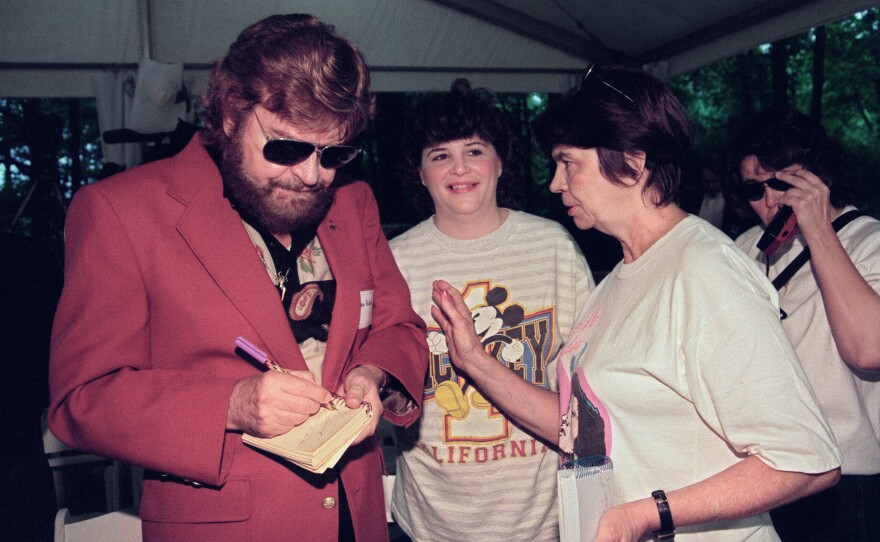 Sam Phillips signs autographs in Memphis, Tenn., in June 1992.