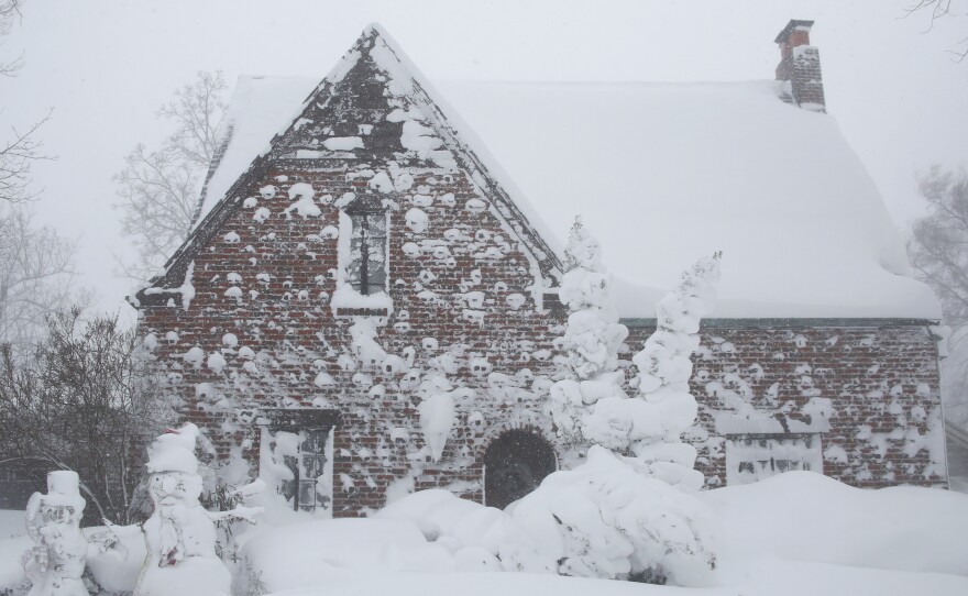 A winter storm rolls through Western New York Saturday, Dec. 24, 2022, in Amherst N.Y. A battering winter storm has knocked out power to hundreds of thousands of homes homes and businesses across the United States on Saturday. It left millions more to worry about the prospect of further outages and crippled police and fire departments.