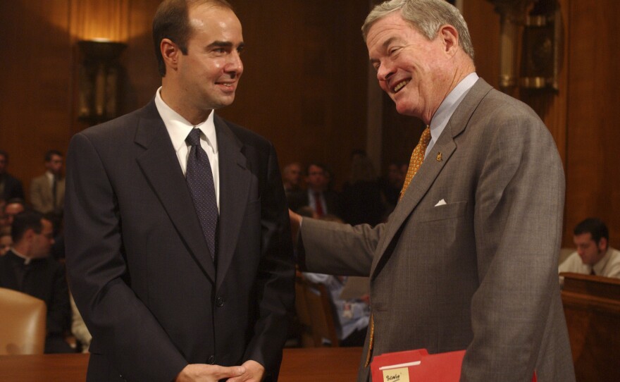 Eugene Scalia (left) talks with Missouri Sen. Kit Bond before Scalia's confirmation hearing to be solicitor of the Labor Department in 2001.