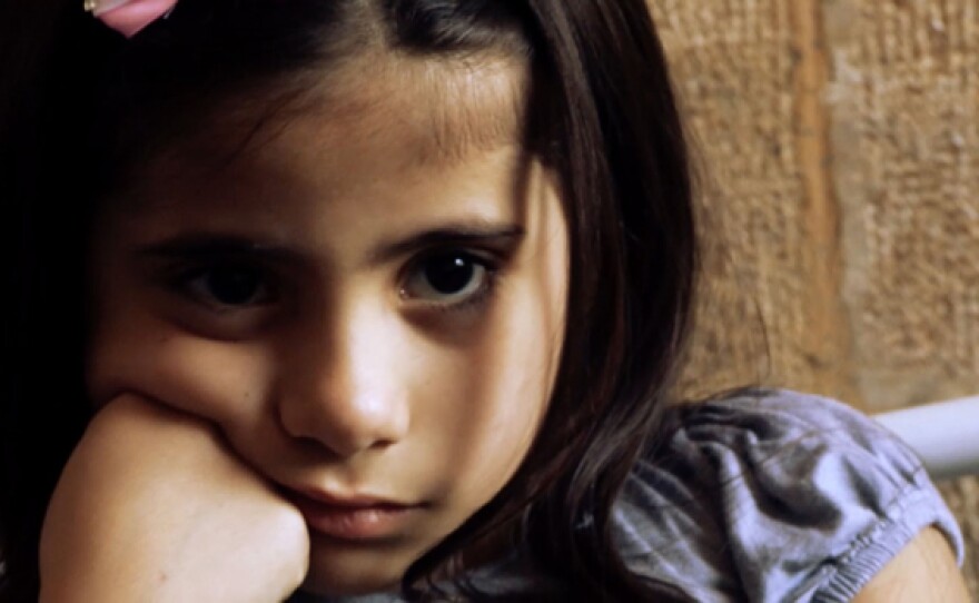 Syrian child. FRONTLINE tells the story of four children surviving in war-torn Aleppo, and their escape to a new life in Germany. The film follows the family over three years, from the siege of their city to the kidnapping of their father to the struggle of becoming refugees.