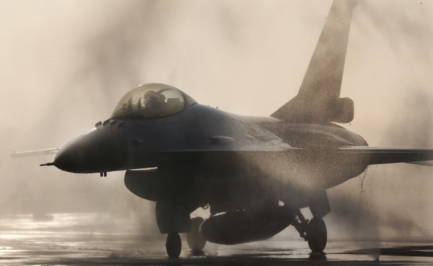 An F-16 jet fighter is washed on the tarmac at an air force base in Taiwan. The State Department has approved the sale of 66 fighter jets to the island.
