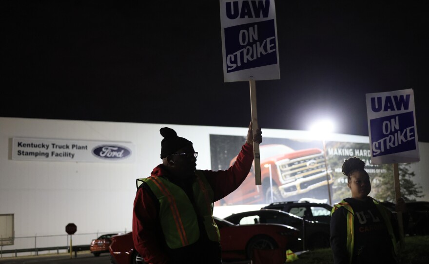 Workers form a picket line outside the Ford Motor Co. Kentucky Truck Plant in the early morning hours on October 12, 2023 in Louisville, Kentucky. This week, a majority of workers at the plant voted no on the tentative contract deal.