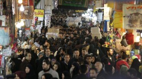 Iranians walk through the main bazaar in Tehran in January. Sanctions by the EU and U.S., plus political woes related to the Syrian uprising, have created the most serious crisis faced by Tehran since the 1980s.