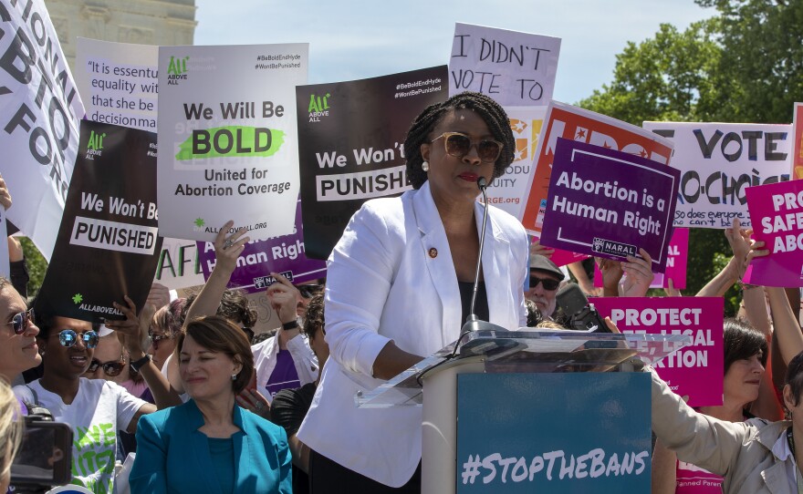 Rep. Ayanna Pressley, D-Mass., speaks at an abortion-rights rally at the U.S. Supreme Court on Tuesday in Washington, D.C. It was part of a day of action nationwide to protest a wave of state laws restricting abortion.