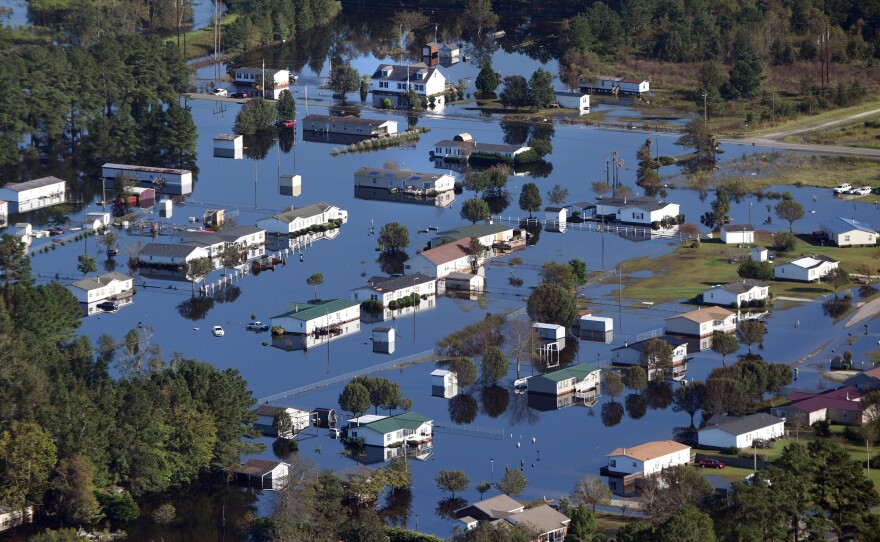 Aerial views of flooding and submerged homes in Lumberton, N.C., on Thursday.
