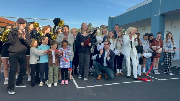 Students cut the ribbon to mark the official completion of a modernization project at Pacific Beach Elementary School on Feb. 2, 2025.