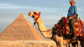 On camel back, Richard Bangs visits the Great Pyramids of Giza near Cairo, Egypt, before sailing up the Nile River to the Valley of the Kings, Kom Ombo, and Lake Nasser in his “Quest For The Lord Of The Nile” through Egyptian history. 