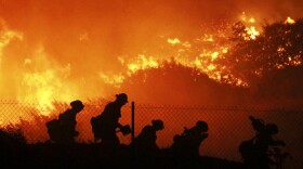 Firefighters battle the Saddleridge fire in Sylmar, Calif., Friday Oct. 11, 2019. 