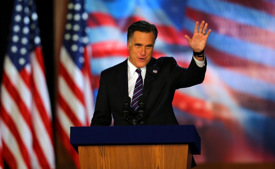 Republican presidential candidate, Mitt Romney, waves to the crowd while speaking at the podium as he concedes the presidency during Mitt Romney's campaign election night event at the Boston Convention & Exhibition Center on November 7, 2012 in Boston, Massachusetts.