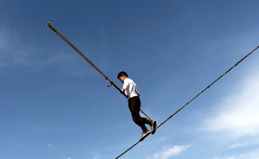 A Turkish tightrope walker shows his skills at the games.