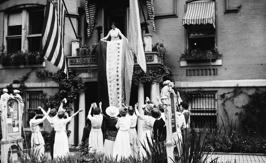 Alice Paul, a leader of the National Woman's Party, unfurls the ratification banner with its new 36th star after Tennessee ratified the 19th Amendment on Aug. 18, 1920. The amendment prohibits denying the right to vote based on sex.