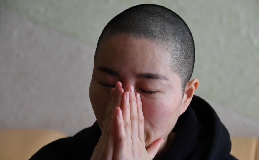 Li Wenzu, the wife of imprisoned lawyer Wang Quanzhang, reacts before an interview at her home in Beijing. Wang, a prominent Chinese human rights lawyer, was sentenced on Jan. 28 to 4 1/2 years in prison for state subversion.