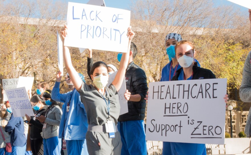 Medical residents and fellows protest the university's vaccine allocation process outside Stanford Hospital on Friday morning in Palo Alto, Calif.