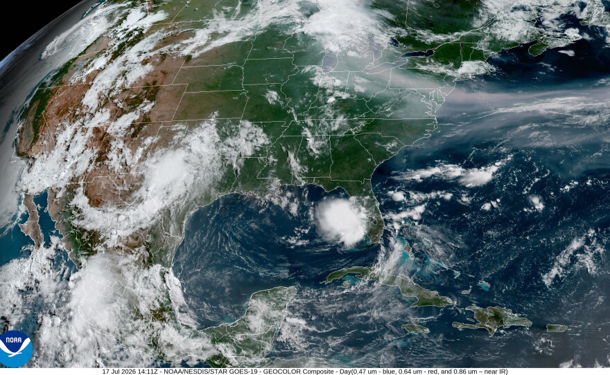 A satellite image from 8 a.m. ET shows a plume of dark smoke extending from Minnesota to Virginia and out into the Atlantic Ocean.