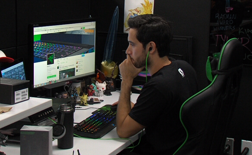 Razer employee Josh Collins keeps tabs on what fans are saying about Razer products on social media, July 19, 2016.