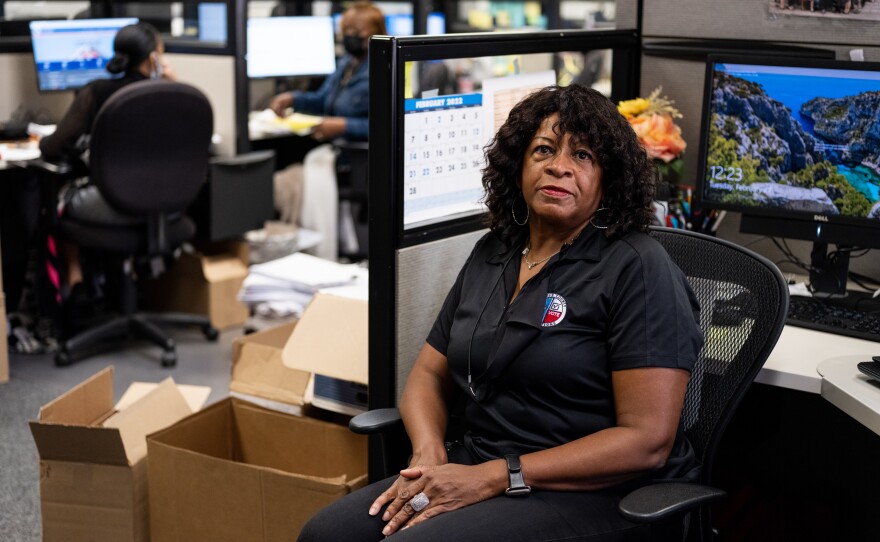 Nayda Arnold, the deputy director of voter services, says she spends a lot of time on the phone to make sure each voter feels comfortable.