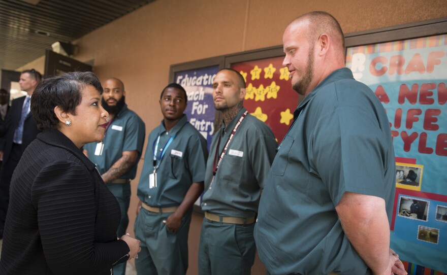 Attorney General Lynch talks with inmates, from left, Tobin Lyon, Bilal McElroy, Derrick Cash and Derek William Spinks, during a visit to Talladega Federal Correctional Institution on April 29, 2016.