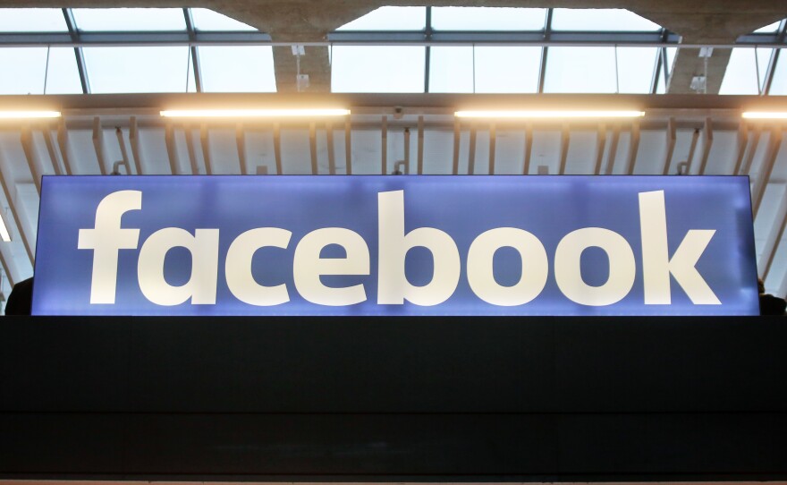 The Facebook logo is displayed at a startup gathering in Paris on Jan. 17.