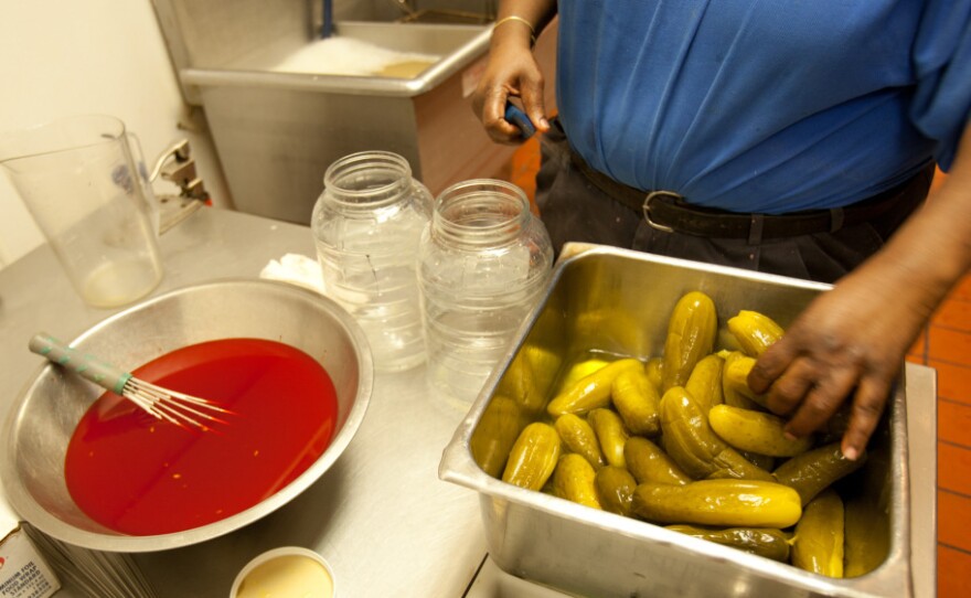 The making of Kool-Aid pickles at a Mississippi Double Quick convenience store.
