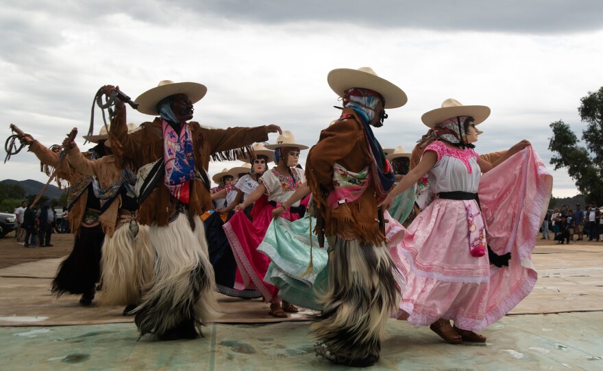 Dancers in the Oaxacan dance group Los Rubios Santo Niño de Atocha dance in front of a crowd at a event in Valley Center, California on September 21, 2025.